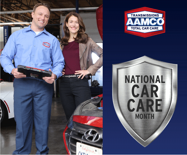 Man and woman stand smiling next to car, badge that says "National Car Care Month"