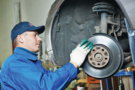 Car mechanic worker repairing